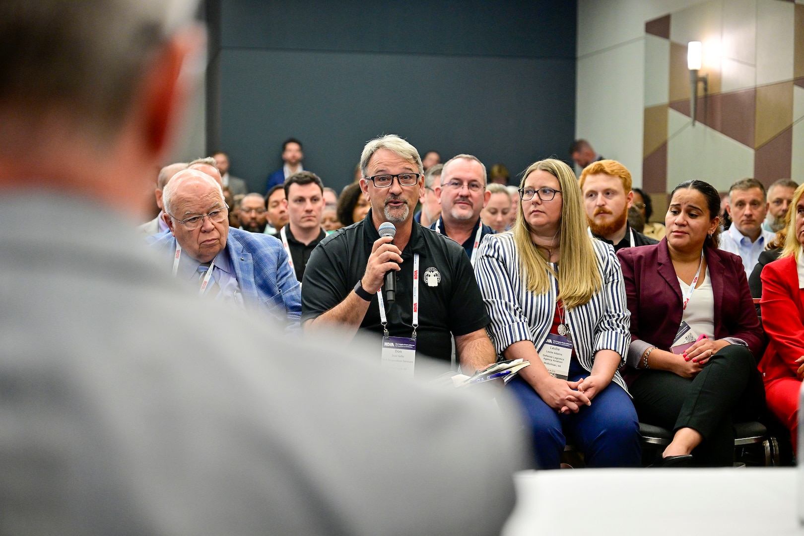 Attendees pose questions to a panel of Defense Logistics Agency supplier operations experts