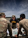 Sgt. Daniel Leikin, a ranger instructor assigned to the Army National Guard Warrior Training Battalion, evaluates Soldiers conducting planning during Light Leaders Course on June 8, 2025 at Camp Gruber Training Center, Oklahoma. Light Leaders Course is an intensive, leadership development program designed to sharpen small unit tactics and develop agile, adaptable and deployment-ready combat leaders. (Oklahoma National Guard photo by Spc. Cambrie Cannon)