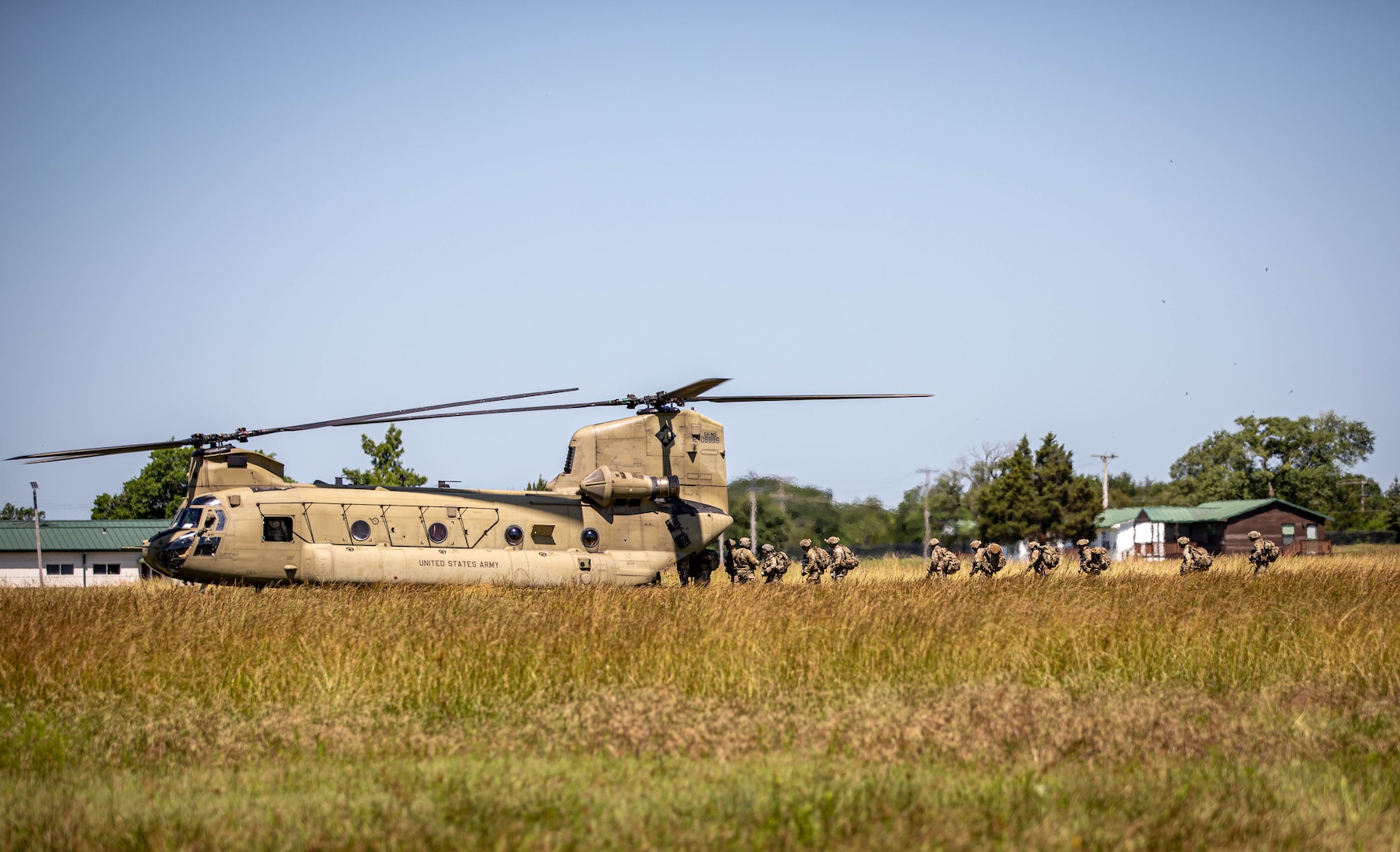 Oklahoma National Guardsmen board a CH-47 Chinook helicopter in preparation for an air insertion during Light Leaders Course on June 8, 2025 at Camp Gruber Training Center, Oklahoma. The course focuses on mastering troop leading procedures, battle drills and small unit tactics to improve leadership, lethality and survivability. (Oklahoma National Guard photo by Spc. Cambrie Cannon)