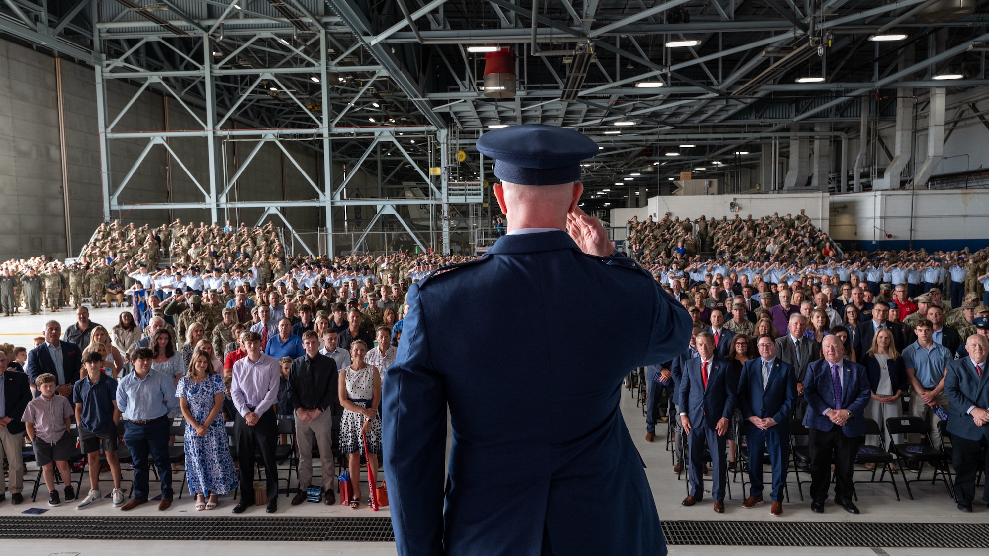 Col. Mark Howard renders his last salute as the 55th Wing commander