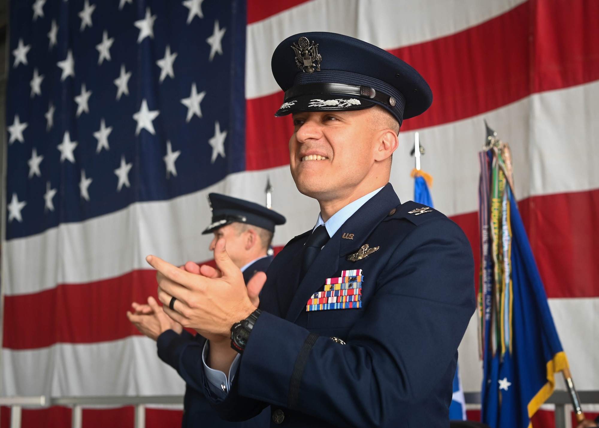 Col. Gray applauds during a speech as he takes command of the 55th Wing.