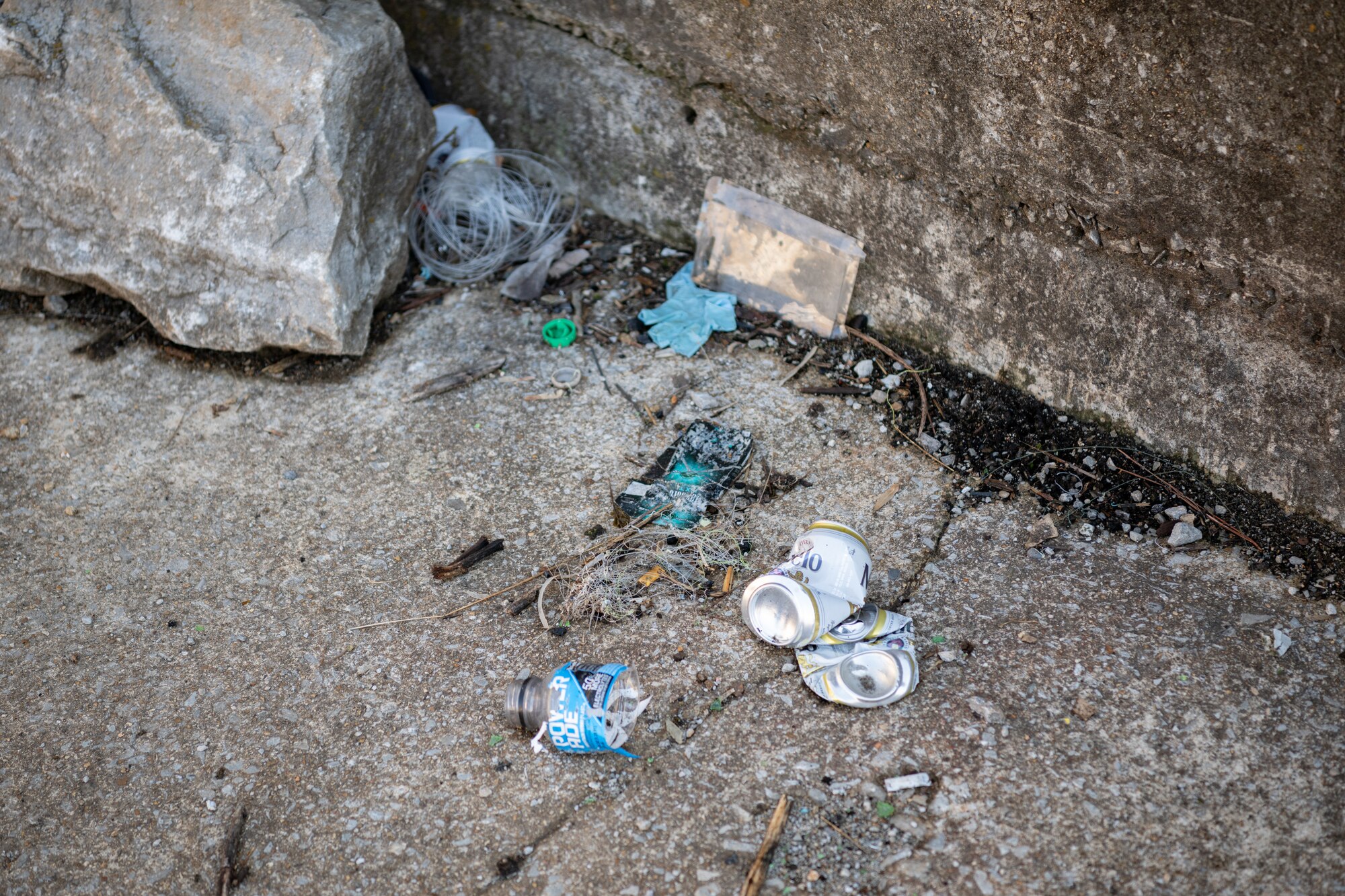 Trash is found scattered along a training wall of the Elk River Dam on Arnold Air Force Base, Tenn., January 28, 2025. Work is set to soon begin to prevent public access to the dam structure through the installation of security fencing around the downstream training walls. The effort is to ensure property security and safety in the area. The river will still be accessible to recreationalists for fishing and other activities. (U.S. Air Force photo by Keith Thornburgh)