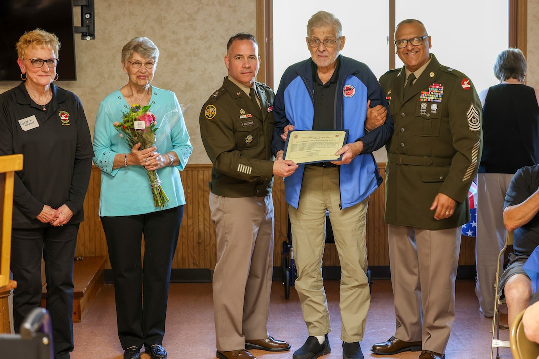 Image of 84th Training Command's command team posing with award recipient.