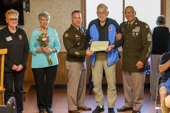 Image of 84th Training Command's command team posing with award recipient.