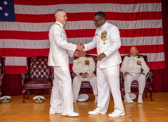 250617-N-KC192-1020 PORTSMOUTH, Va. (June 17, 2025) Rear Adm. Darin K. Via, Navy Surgeon General, arrives as a member of the official party during a change of command ceremony held on board Hampton Roads - Portsmouth Annex, June 17, 2025. During the ceremony, Rear Adm. Kevin Brown was relieved by Rear Adm. Robert Hawkins, after serving as the commander, Naval Medical Forces Atlantic and director of Defense Health Network - Atlantic. (U.S. Navy photo by Mass Communication Specialist 2nd Class Levi Decker)