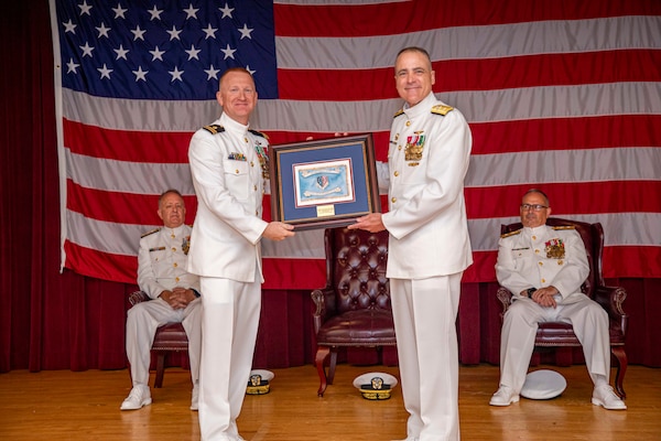 250617-N-KC192-1067 PORTSMOUTH, Va. (June 17, 2025) The Defense Health Network - Atlantic’s wardroom presents Rear Adm. Kevin Brown, former Naval Medical Forces Atlantic commander, and director of Defense Health Network - Atlantic with a going away gift during a change of command ceremony held on board Hampton Roads - Portsmouth Annex, June 17, 2025. During the ceremony, Brown was relieved by Rear Adm. Robert Hawkins. (U.S. Navy photo by Mass Communication Specialist 2nd Class Levi Decker)