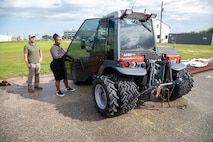 Galveston District Logistics Management Specialist and Property Book Officer Sequoia A. Hopkins (right) opens the door on a hillside mower acquired via government equipment channels June 9, 2025. Hopkins was recently named the USACE Directorate of Logistics' “Outstanding Logistician of the Year”.