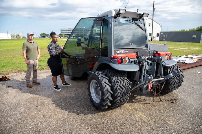 Galveston District Logistics Management Specialist and Property Book Officer Sequoia A. Hopkins (right) opens the door on a hillside mower acquired via government equipment channels June 9, 2025. Hopkins was recently named the USACE Directorate of Logistics' “Outstanding Logistician of the Year”.
