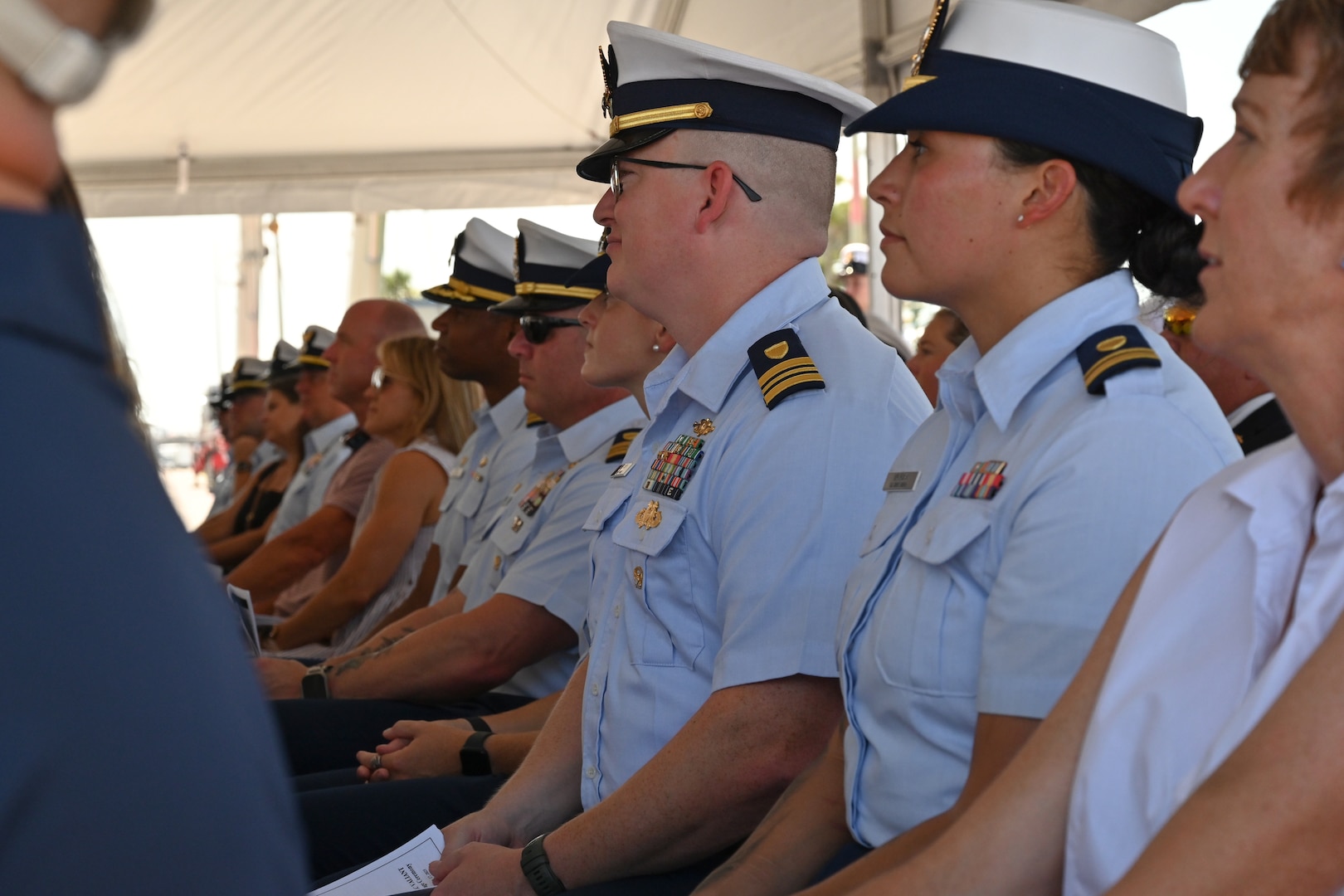 The crew of Coast Guard Cutter Valiant (WMEC 621), former crew members, family and friends attend the cutter's heritage recognition ceremony at Naval Station Mayport in Jacksonville, Florida, June 17, 2024. The cutter was honored after more than 57 years of service to the nation. (U.S. Coast Guard photo by Petty Officer 2nd Class Brandon Hillard)