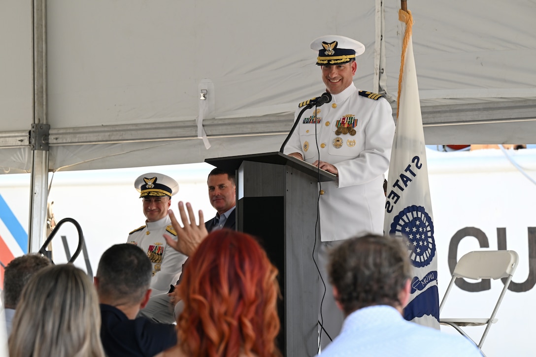 Cmdr. Matthew Press, commanding officer of Coast Guard Cutter Valiant (WMEC 621), engages with the audience during the cutter's heritage recognition ceremony in Jacksonville, Florida, June 17, 2024. The cutter was honored after more than 57 years of service in front of Coast Guard and cutter leadership, the assembled crew and former crew members, family and friends. (U.S. Coast Guard photo by Petty Officer 2nd Class Brandon Hillard)