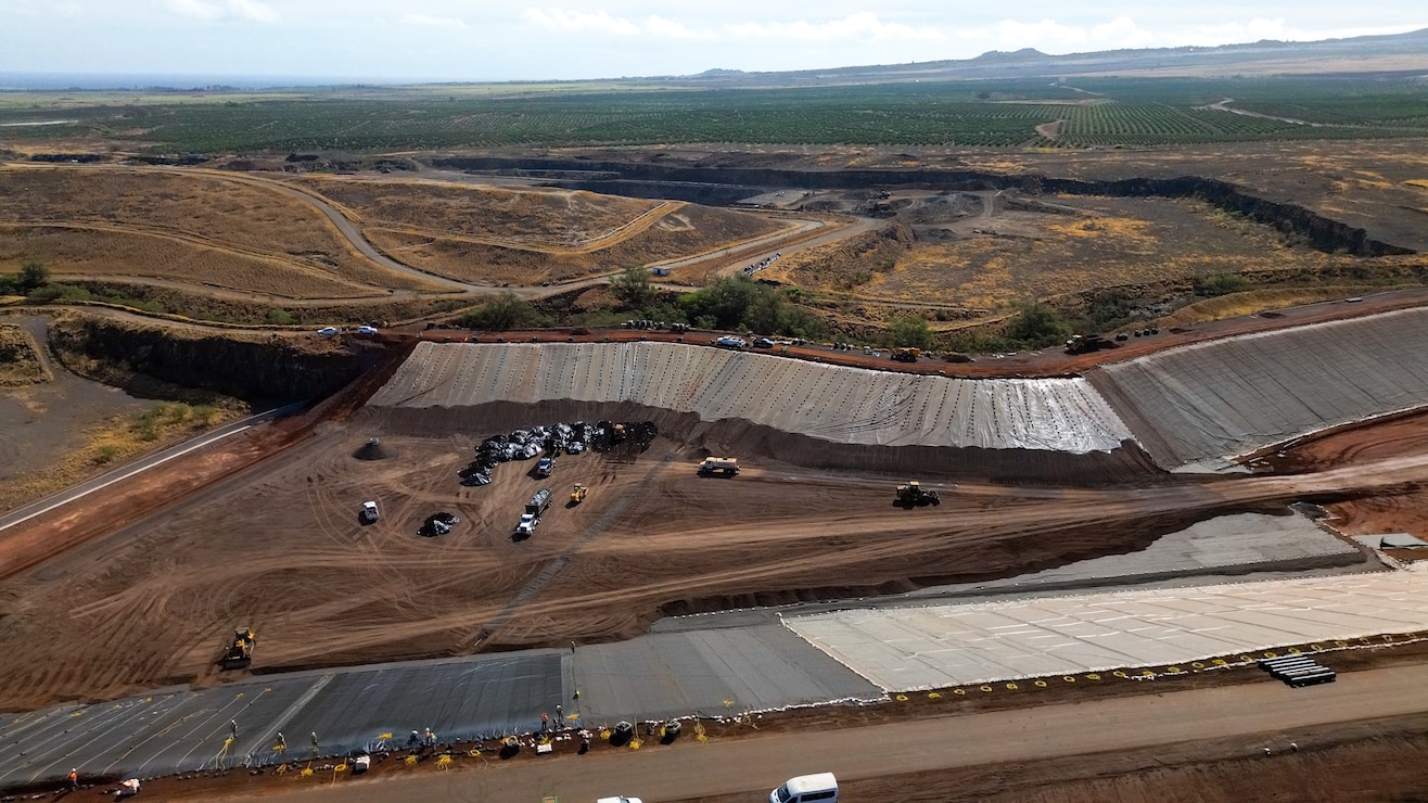 Dump trucks unloads Lahaina wildfire debris at the Permanent Disposal Site adjacent to the Central Maui Landfill in Puʻunēnē June 16, 2025. A total of approximately 400,000 tons of debris will be moved to the permanent site over five months. (Photo Courtesy of Mia A'i, County of Maui Public Affairs).