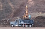 An excavator loads Lahaina wildfire debris into a dump truck at the Olowalu Temporary Debris Storage site before it is transported to the Permanent Disposal Site adjacent to the Central Maui Landfill in Puʻunēnē June 16, 2025. A total of approximately 400,000 tons of debris will be moved to the permanent site over five months. (Photo Courtesy of Nicole Timon-Shipman, Federal Emergency Management Agency Public Affairs).