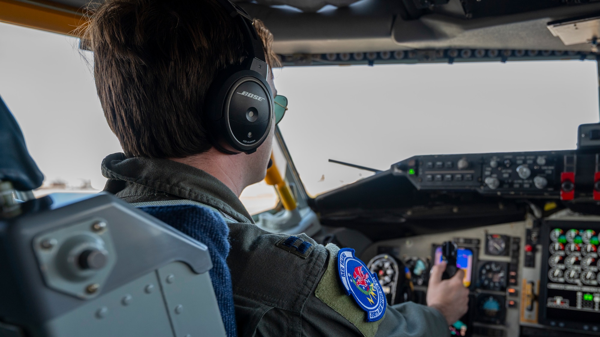 An Airman sits in the cockpit, awaiting takeoff.