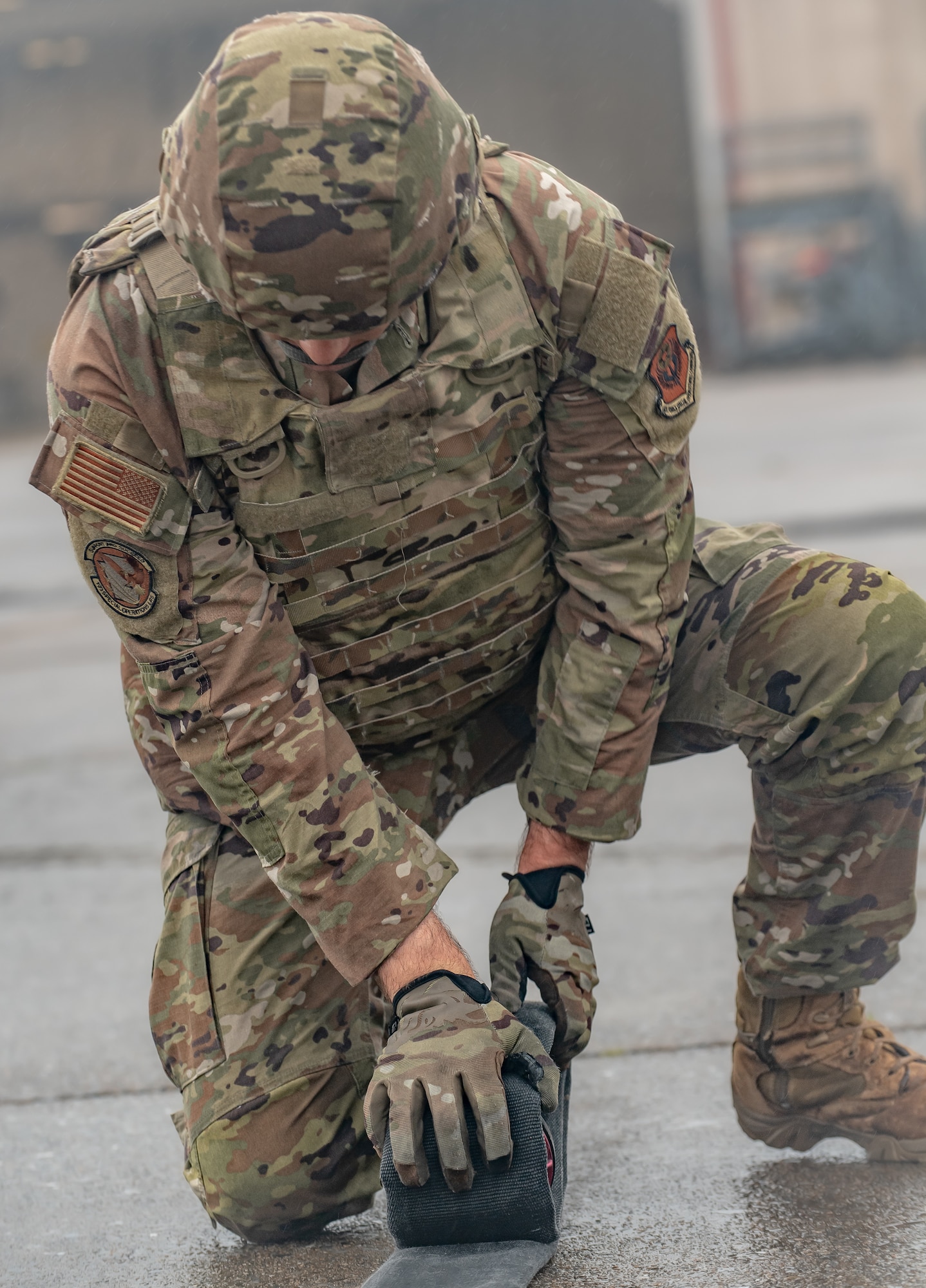 A special operations Airman here rolls out a hose during a Forward Arming and Refueling Point tryout at the 193rd Special Operations Wing June 17, 2025.