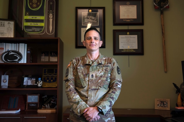 U.S. Army Sgt. Maj. Lauren Flores, Defense POW/MIA Accounting Agency senior enlisted advisor, poses for a photo in her office at Joint Base Pearl Harbor-Hickam, Hawaii, on June 6, 2025. Flores is the first woman to hold the position since the establishment of the modern-day accounting mission. (U.S. Air Force photo by Staff Sgt. Dallin Wrye)