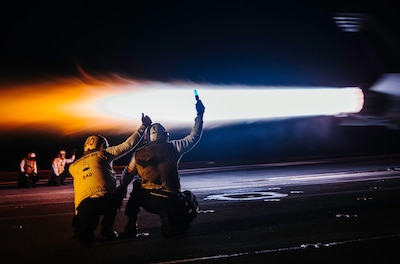 U.S. 7TH FLEET AREA OF RESPONSIBILITY (June 16, 2025) — Sailors signal for an F/A-18F to launch off the flight deck of Nimitz-class aircraft carrier USS George Washington (CVN 73) while underway in the Philippine Sea, June 16, 2025. The USS George...