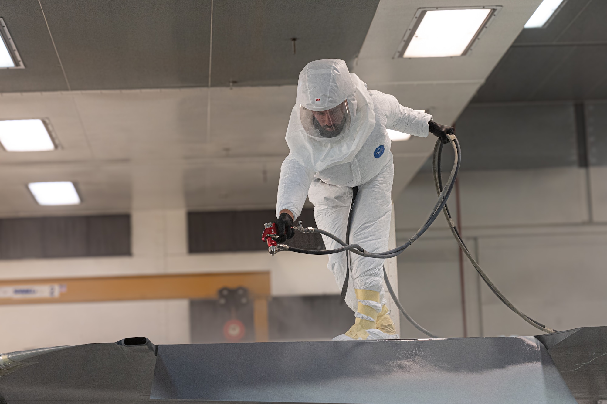 Man paints jet at Mountain Home Air Force Base