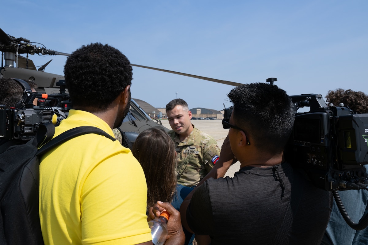 CW2 Caleb Lindsay speaks with reporters during a media engagement.