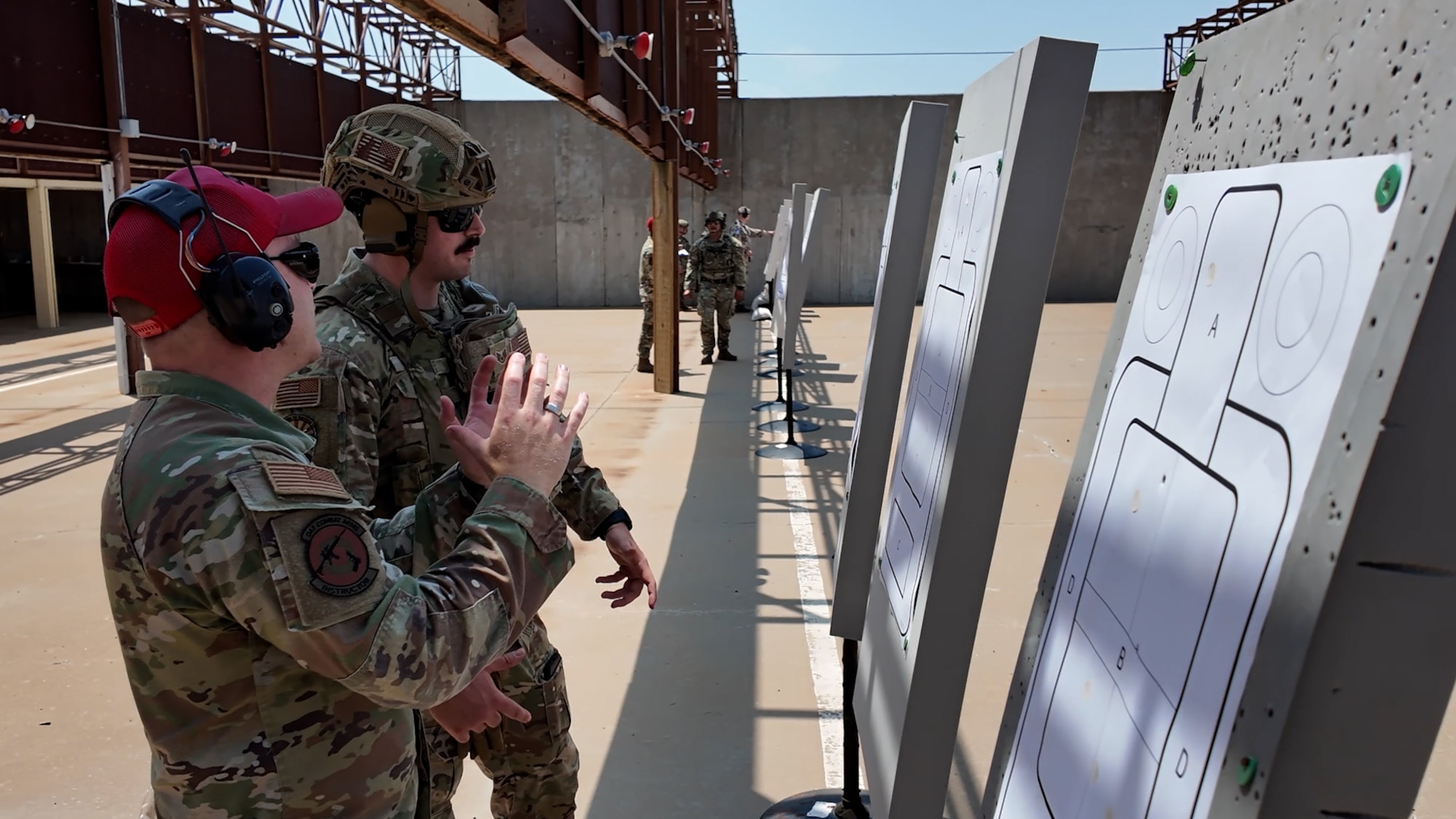 Participants inspect target for accuracy during the marksmanship part of the German Armed Forces Proficiency Badge.
