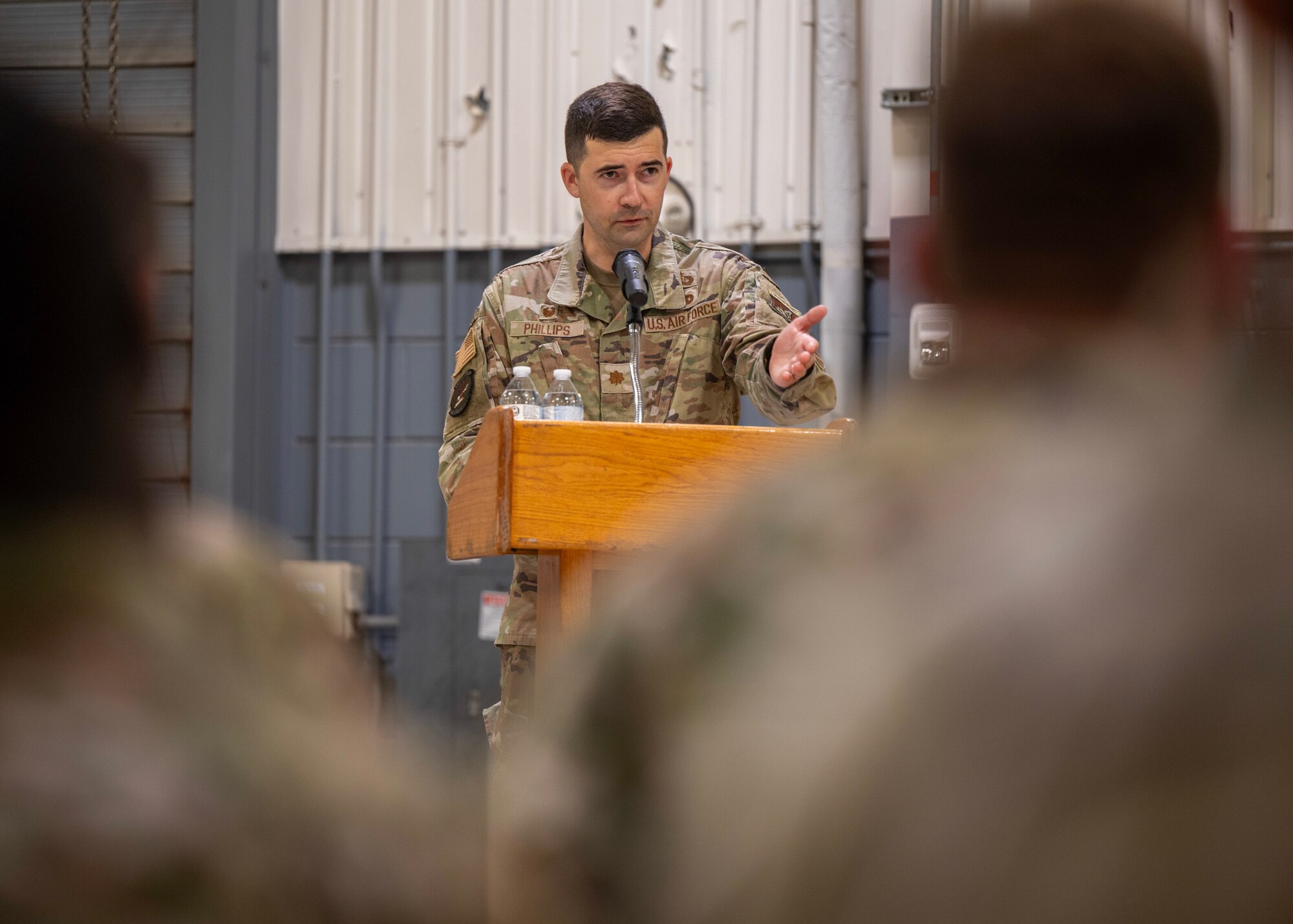 U.S. Air Force Maj. James Phillips, incoming 51st Munitions Squadron commander, addresses the squadron during a Change of Command ceremony at Osan Air Base, Republic of Korea, June 17, 2025. Prior to assuming command, Phillips served as the 4th Munitions Squadron commander at Seymour Johnson Air Force Base, North Carolina. (U.S. Air Force photo by Staff Sgt. Sarah Williams)