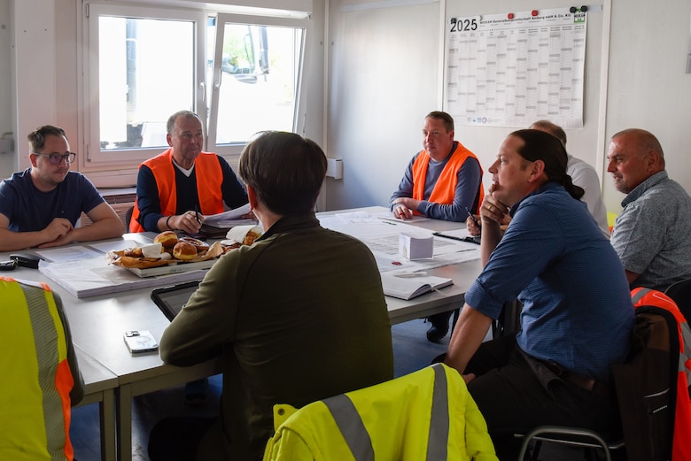 group of people sitting around a table