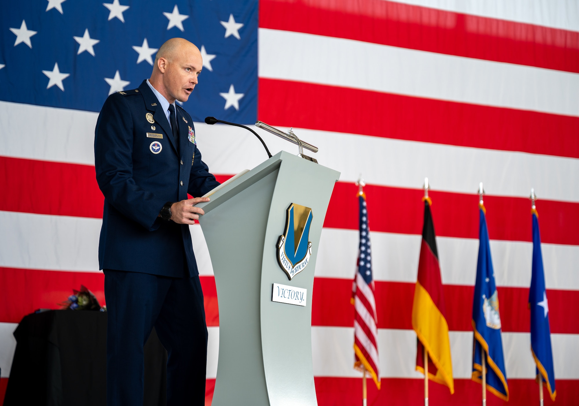 U.S. Air Force Col. Matthew Wunderlich, 86th Operations Group commander, provides remarks during the 86th OG change of command ceremony at Ramstein Air Base, Germany, June 18, 2025. The mission of the 86th OG is to provide resilient, agile power projection, airlift and aeromedical evacuation. (U.S. Air Force photo by Senior Airman Jared Lovett)