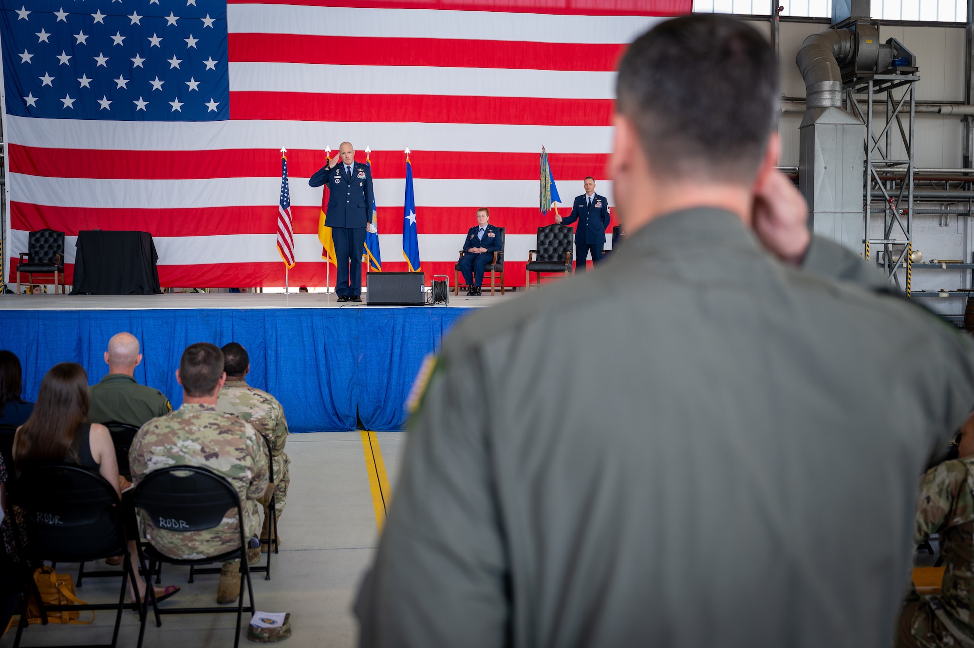 U.S. Air Force Col. Matthew Wunderlich, 86th Operations Group commander, renders his first salute to the 86th OG during the 86th OG change of command ceremony at Ramstein Air Base, Germany, June 18, 2025. The 86th OG consists of five squadrons, including an Aeromedical Evacuation Squadron, a geographically-separated Air Base Squadron and is home to more than 600 active duty, reserve, Department of Defense and local national personnel. (U.S. Air Force photo by Senior Airman Jared Lovett)