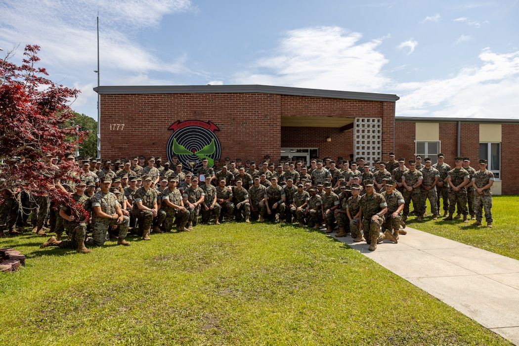 U.S. Marines with Marine Air Control Squadron (MACS) 2 pose for a picture after being awarded II MEF's Lt. Gen. "Chesty” Puller Award at Marine Corps Air Station Cherry Point, North Carolina, June 17, 2025. The Lt. Gen. "Chesty” Puller Award is awarded to units within II MEF that showed outstanding ability and superior performance in supporting the mission of the II MEF within the past year. (U.S. Marine Corps photo by Lance Cpl. Gavin K. Kulczewski)