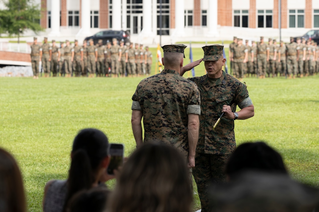 The ceremony represented a transfer of responsibility, authority, and accountability from Nevinger to Sgt. Maj. Robert Schieler (U.S. Marine Corps photo by Lance Cpl. Mya Seymour)