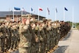 U.S. Soldiers, supporting Task Force Voit and NATO Allies, salute for the national anthem during an Estonian-led award ceremony on Camp Tapa, Estonia, June 4, 2025. U.S. Soldiers, along with NATO Allies, received the NATO Kaitsel "Defender" Medal for their contribution to the NATO Enhanced Forward Presence mission in Estonia. (U.S. Army photo by Sgt. Austin Steinborn)