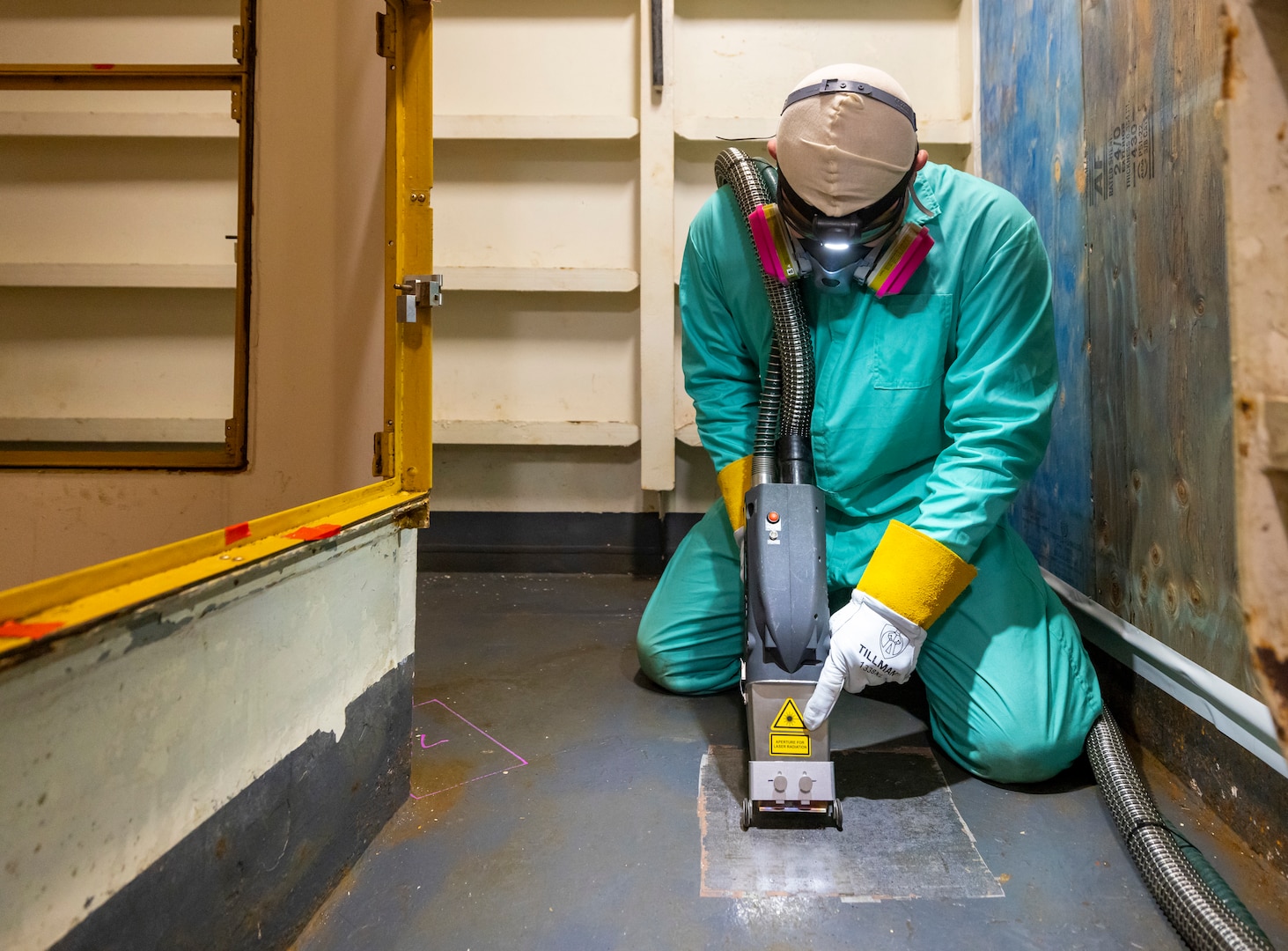 Chase Absher, painter, Shop 71, Painters, Blasters, Tilesetters, works with a laser ablation tool aboard USS Ronald Reagan (CVN 76), May 21, 2025, at Puget Sound Naval Shipyard & Intermediate Maintenance Facility in Bremerton, Washington. (U.S. Navy photo by Wendy Hallmark)