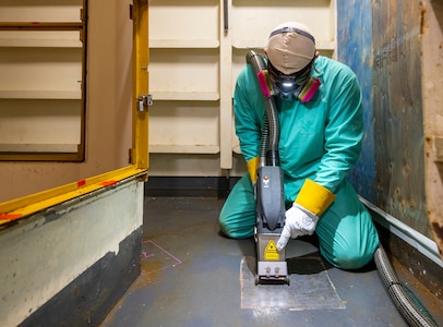 Chase Absher, painter, Shop 71, Painters, Blasters, Tilesetters, works with a laser ablation tool aboard USS Ronald Reagan (CVN 76), May 21, 2025, at Puget Sound Naval Shipyard & Intermediate Maintenance Facility in Bremerton, Washington. (U.S. Navy photo by Wendy Hallmark)