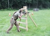 A competitor engages steel targets during the 2025 FTIG 2-Gun Steel Shoot at Fort Indiantown Gap, Pennsylvania, June 14, 2025. The event challenged participants with rifle and pistol stages focused on speed, accuracy and weapon handling, bringing together Soldiers and civilian staff in a competitive, morale-boosting environment. (U.S. Army National Guard photo by Sgt. Vail Forbeck)