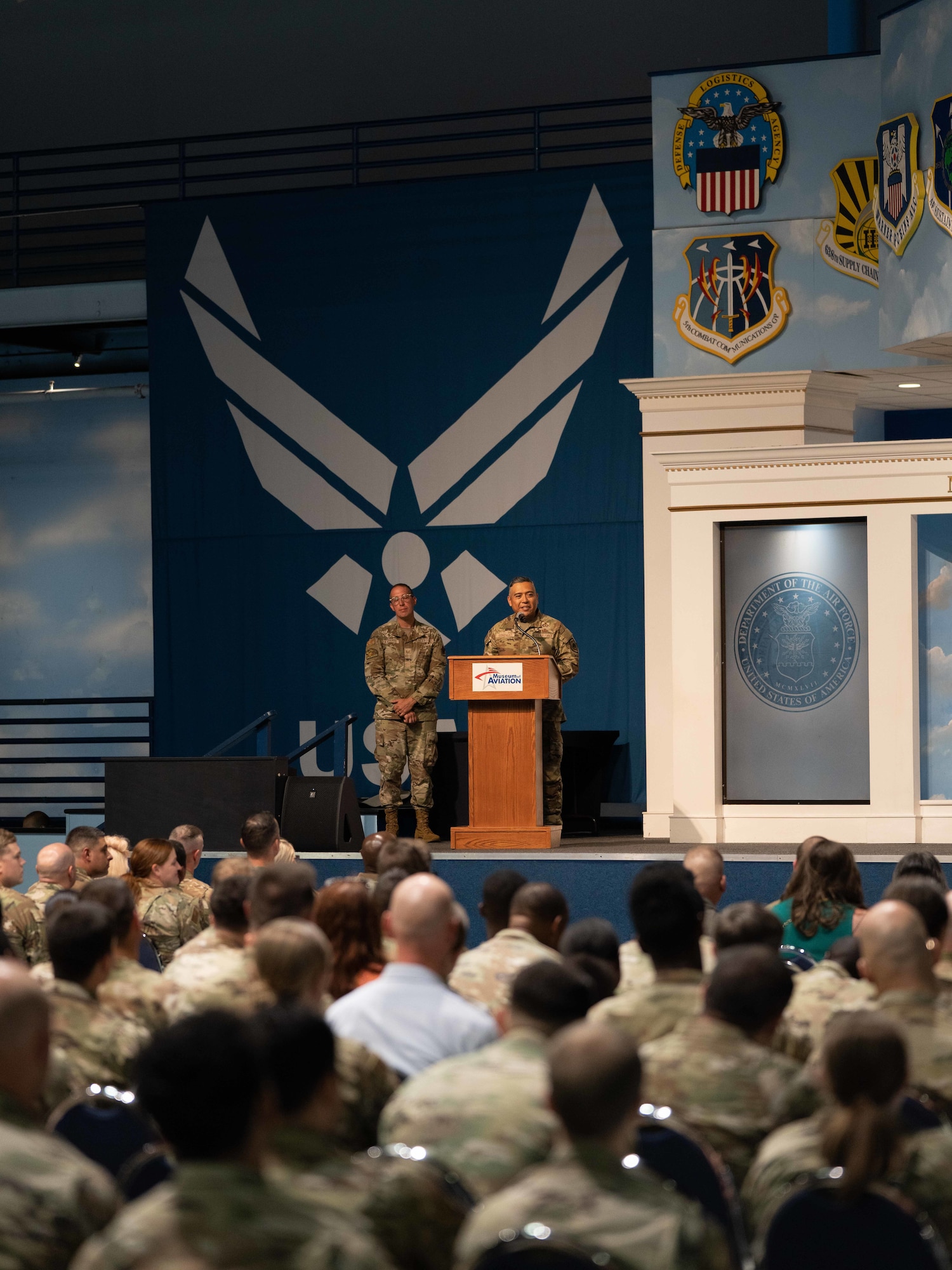 Man in military podium standing at a podium while speaking