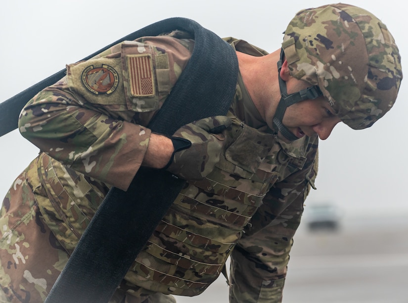 A special operations refueler here carries a hose during a Forward Arming and Refueling Point tryout at the 193rd Special Operations Wing June 17, 2025.
