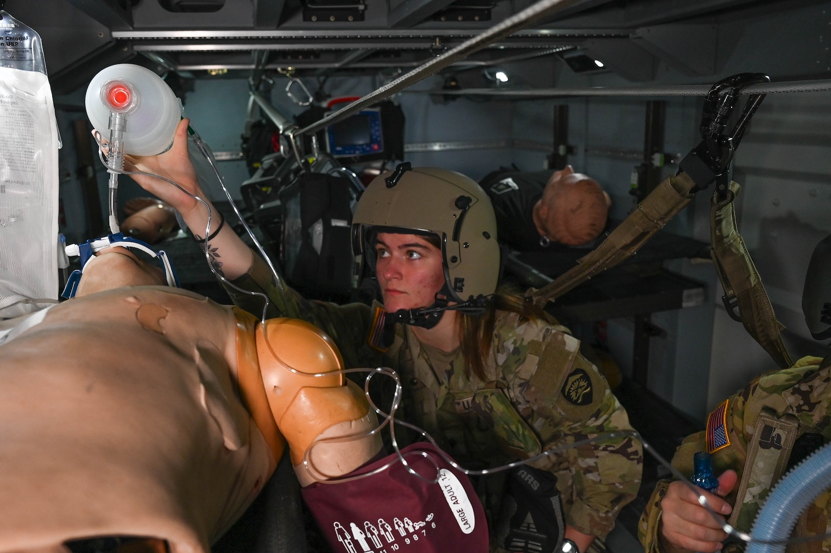 Oregon Army National Guard Golf Company 189th Aviation Spc. Natalie Foote simulates giving rescue breaths to a medical mannequin during the Special User Evaluation for the Future Long Range Aviation Aircraft (FLRAA) MEDEVAC patient handling system at the Army Aviation Support Facility, June 13, 2025, in Salem, Ore.