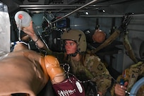 Oregon Army National Guard Golf Company 189th Aviation Spc. Natalie Foote simulates giving rescue breaths to a medical mannequin during the Special User Evaluation for the Future Long Range Aviation Aircraft (FLRAA) MEDEVAC patient handling system at the Army Aviation Support Facility, June 13, 2025, in Salem, Ore.