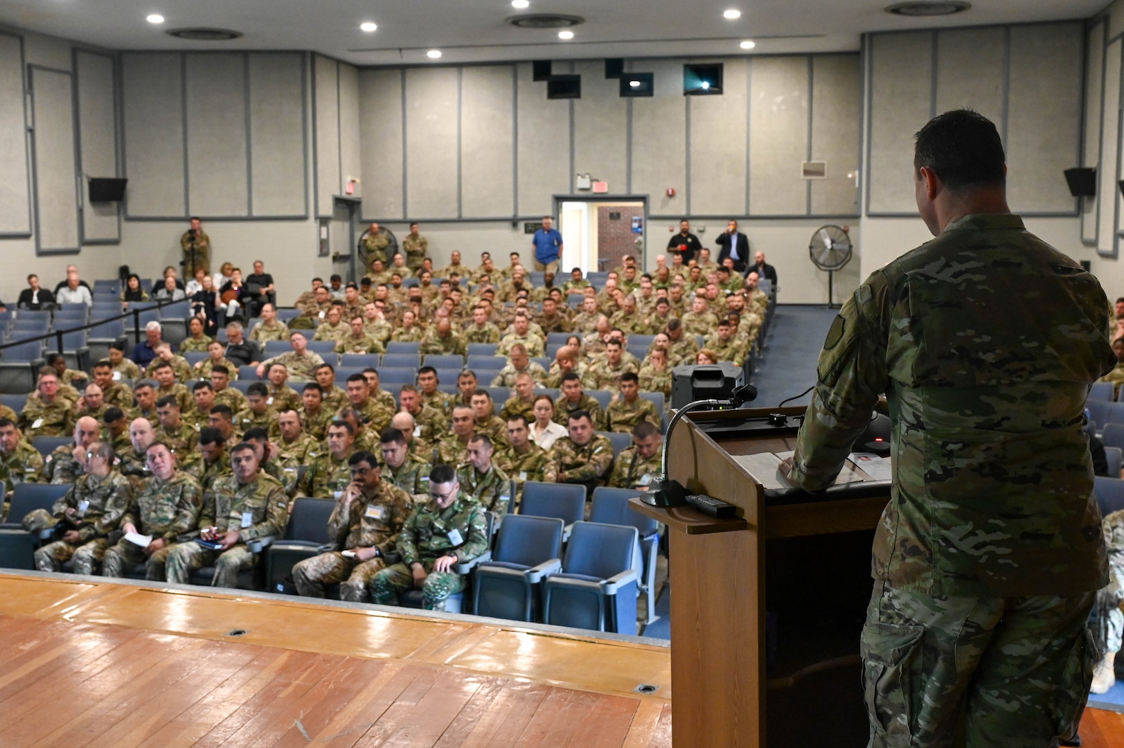 U.S. Army Lt. Col. Randall Phillips, the lead planner and CASA Branch Chief, Phillips welcomes CASA partners to Regional Cooperation 25 at Joint Base Cape Cod, Massachusetts, June 16, 2025, during exercise Regional Cooperation 25. Regional Cooperation 25 is an annual, multi-national U.S. Central Command sponsored command-post and field training exercise conducted by National Guard units in partnership with Central and South Asia nations. (U.S. Air Force photo by Staff Sgt. Colten Tessness)