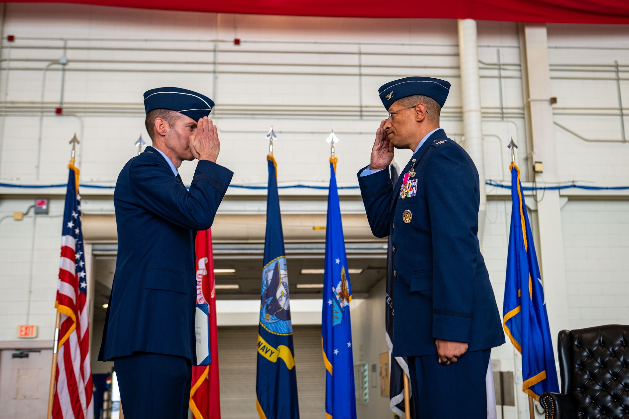 U.S. Air Force Brig. Gen. Stephen Snelson, U.S. Air Force Expeditionary Center commander, returns a salute to Col. Anthony L. Smith, Joint Base McGuire-Dix-Lakehurst and 87th Air Base Wing commander after awarding the Legion of Merit medal during a change of command ceremony at Joint Base MDL, N.J., June 17, 2025.