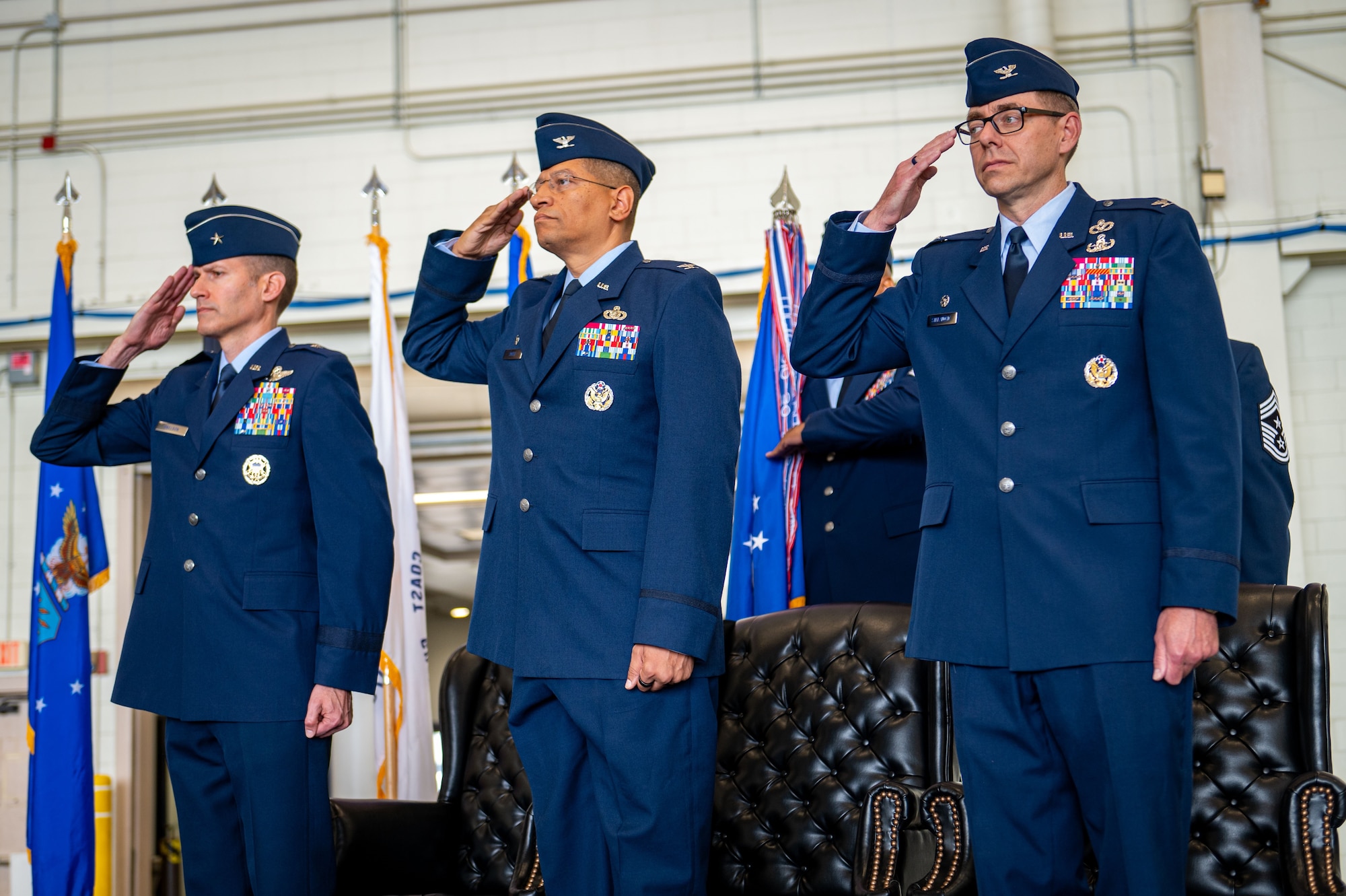 (Left to right) U.S. Air Force Brig. Gen. Stephen Snelson, U.S. Air Force Expeditionary Center commander, Col. Anthony L. Smith, Joint Base McGuire-Dix-Lakehurst commander and 87th Air Base Wing commander and Col. Michael Stefanovic, 87th Civil Engineer Group commander salute during the presentation of colors at the joint base change of command ceremony at JB MDL, N.J., June 17, 2025.