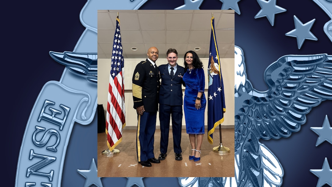 Mother and father pose for photo with their son following college graduation and U.S. Air Force commissioning ceremony.