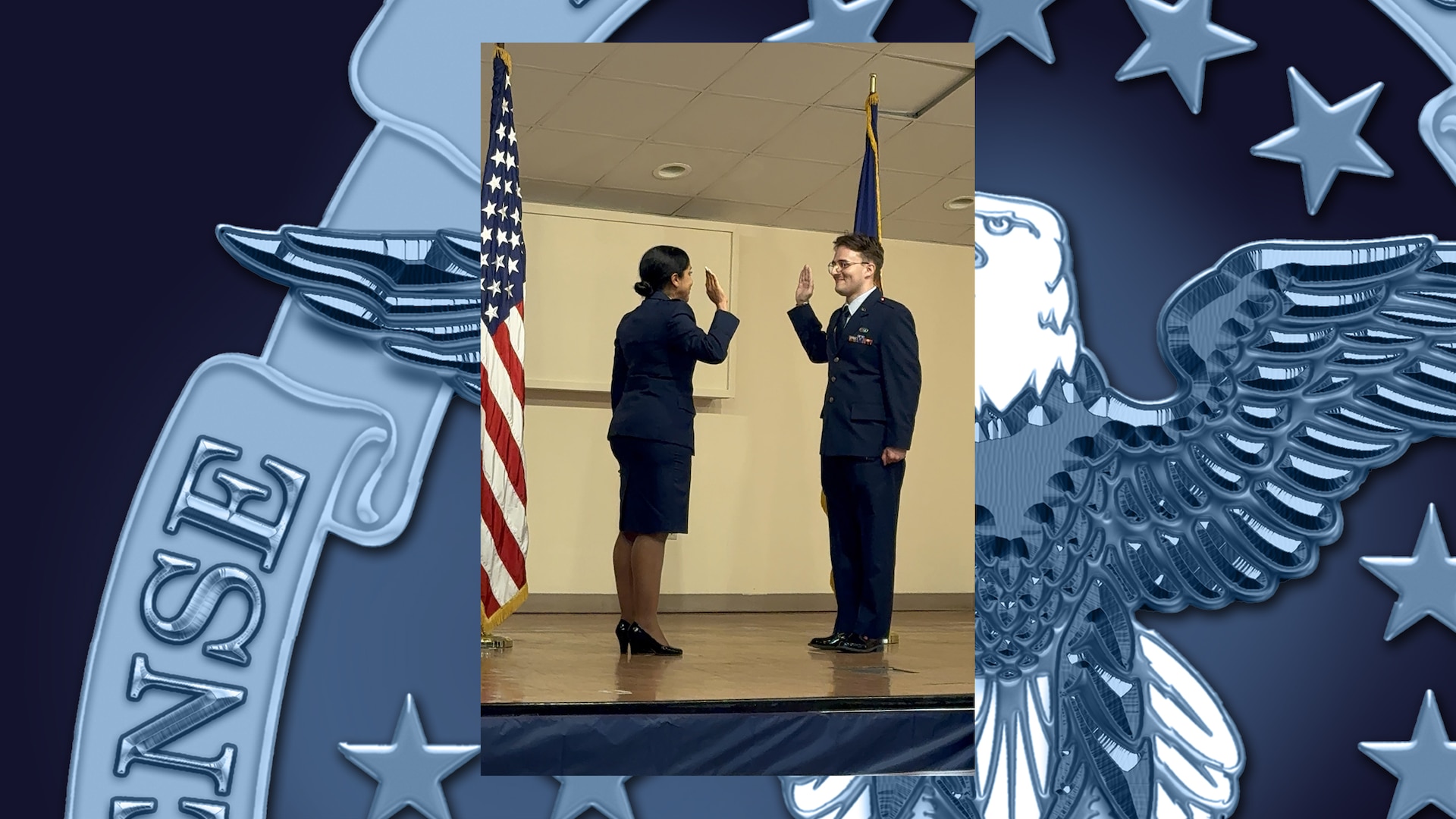 Newly commissioned airmen recites oath of office during ceremony.