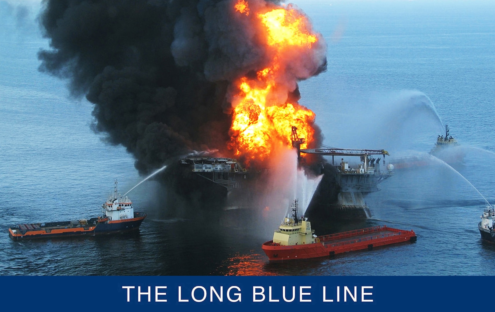 An April 2010 photograph of the Deepwater Horizon offshore oilrig after the explosion that set it on fire and caused its record-breaking oil spill. (U.S. Coast Guard)