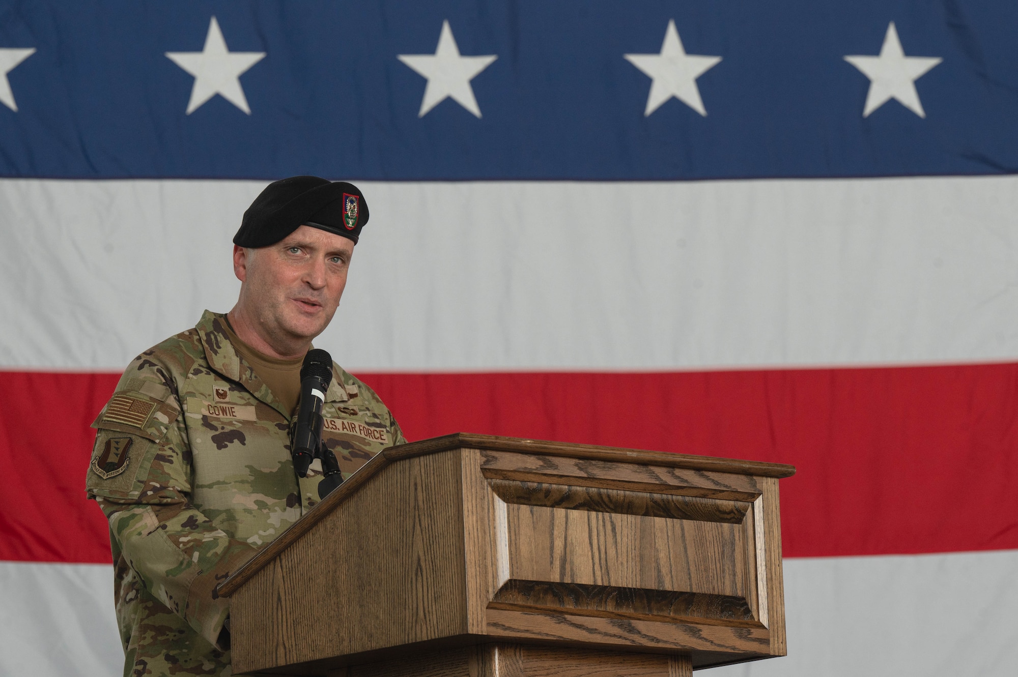 A man speaks at a podium