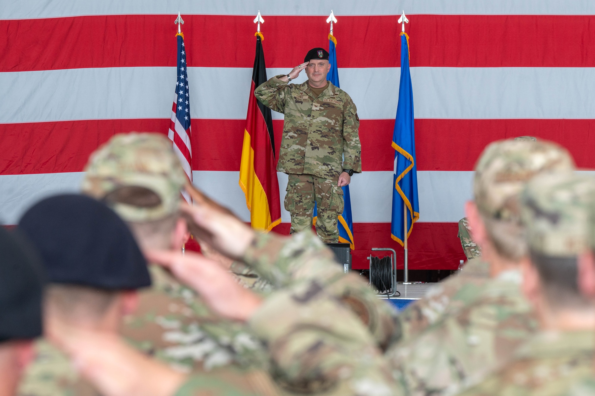 A man salutes a formation