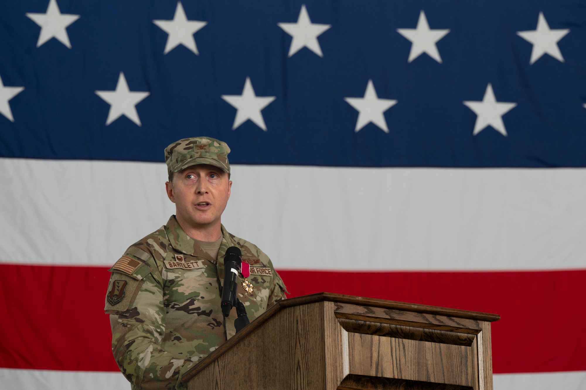 A man speaks at a podium