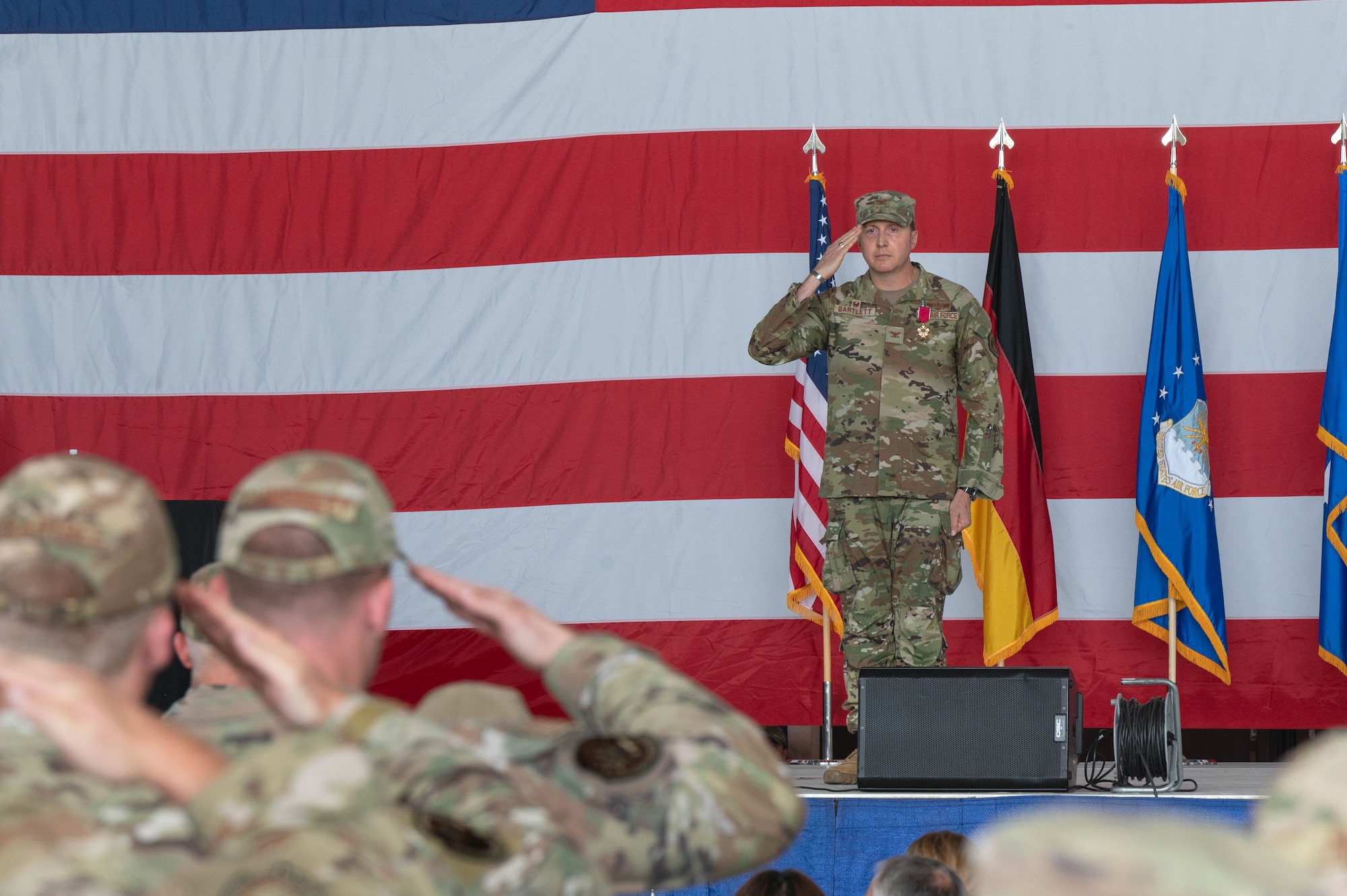 A man salutes a formation