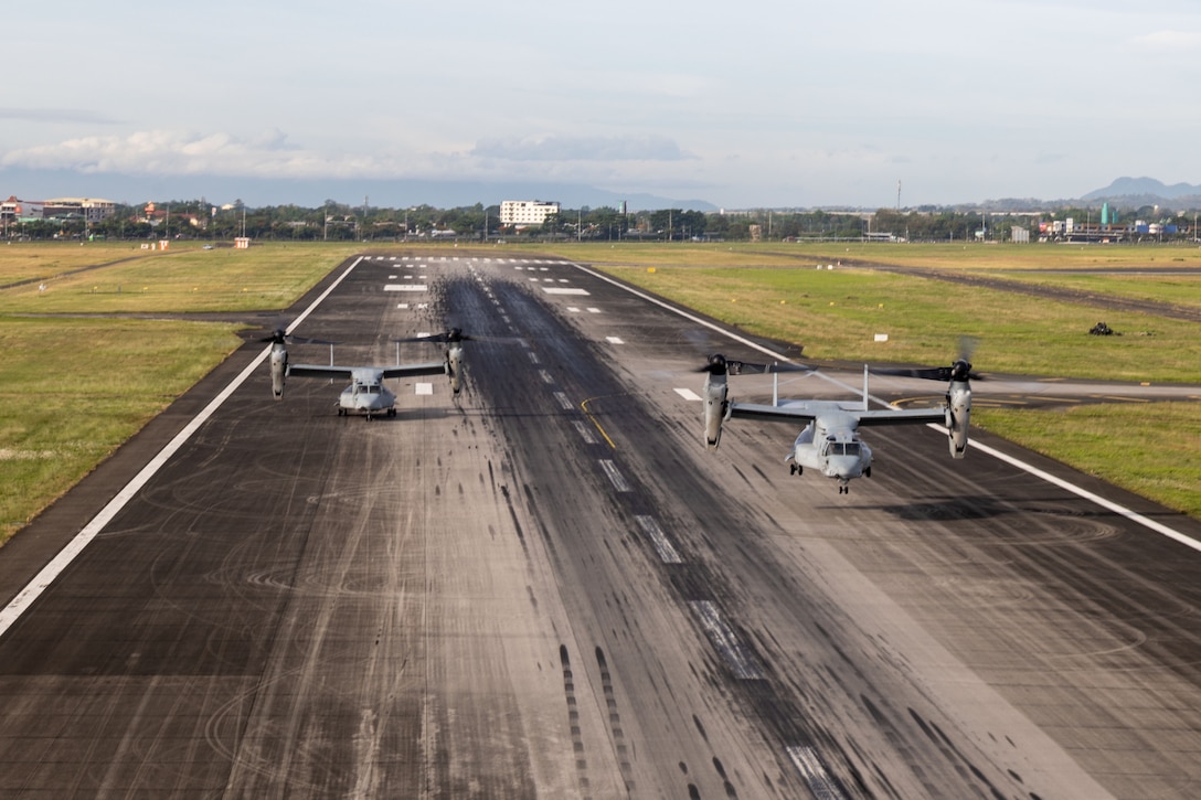 Two U.S. Marine Corps MV-22B Osprey aircraft assigned to  Marine Medium Tiltrotor Squadron (VMM) 364, Marine Aircraft Group 39, 3rd Marine Aircraft Wing, take off from Clark Air Base, Angeles, Philippines, during KAMANDAG 9, May 27, 2025. KAMANDAG is an annual Philippine Marine Corps and U.S. Marine Corps-led exercise aimed at enhancing the Armed Forces of the Philippines’ defense and humanitarian capabilities by providing valuable training in combined operations with foreign militaries in the advancement of a Free and Open Indo-Pacific. (U.S. Marine Corps photo by Staff Sgt. Luc Boatman)
