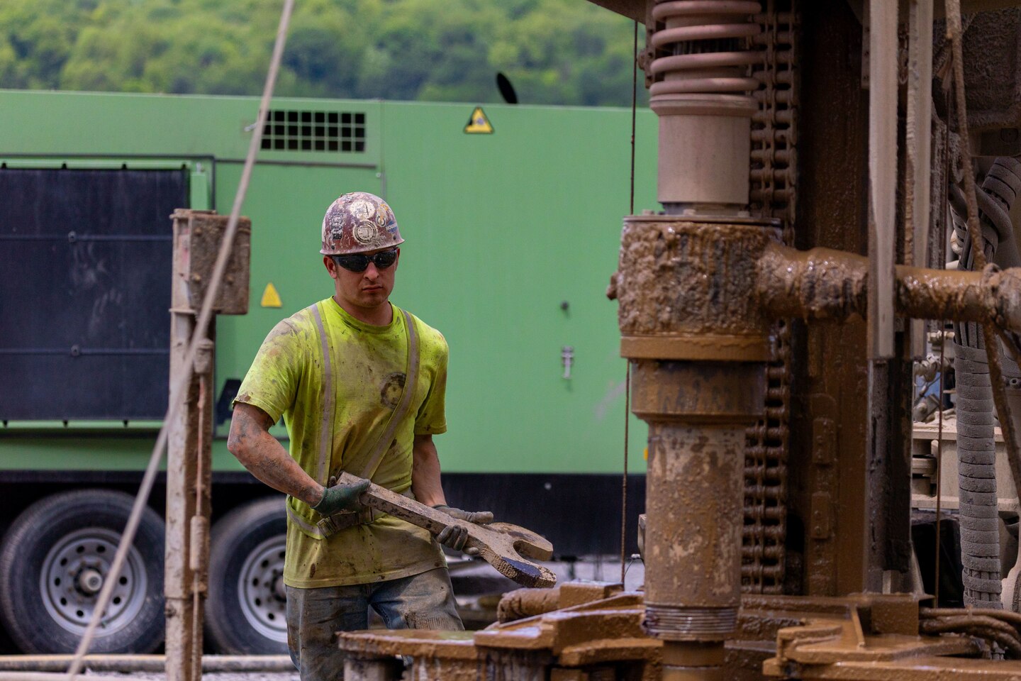 Construction workers make groundbreaking progress at a construction site at a navigational lock along a river.