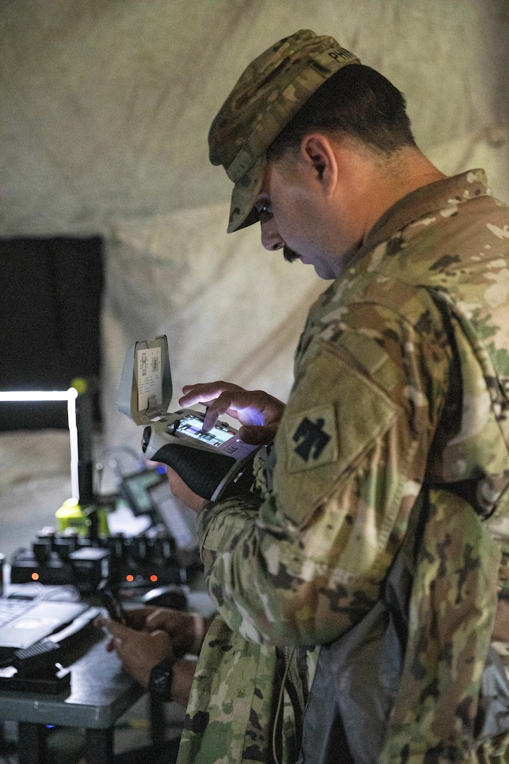Spc. Whalen Phipps, an unmanned aircraft systems operator, assigned to Detachment 1, Delta Company, 545th Brigade Engineer Battalion, 45th Infantry Brigade Combat Team, operates an unmanned aircraft system during a UAS exercise on June 12, 2025 at Camp Gruber Training Center, Oklahoma. The exercise, hosted by the 45th IBCT and featured numerous UAS and counter-UAS systems, focused on preparing infantry Soldiers to react to UAS threats. (Oklahoma National Guard photo by Spc. Cambrie Cannon)